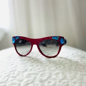 New authentic Prada sunglasses in red with blue stones.
